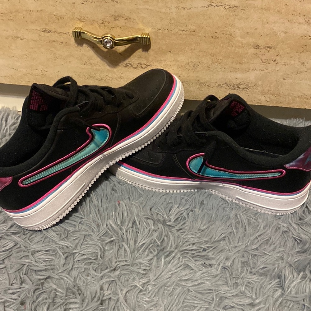 Nike Air Forces,, Black,Pink,and Blue The size is 9 IN MEN